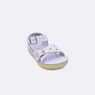 One toddler sized 1400 Sweetheart style sandal with white straps and a white insole. Facing left to right diagonally.