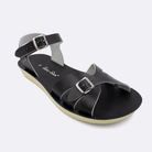One Women's sized 1900 Boardwalk style sandal with black straps and a black insole. Facing left to right diagonally.