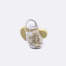 Two baby sized 4200 Sailor style sandals with gold straps and white insoles.  One standing with the sole facing the camera. The second is laying diagonally over the top left edge of the sole.