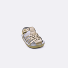 One baby sized 4200 Sailor style sandal with gold straps and a white insole. Facing left to right diagonally.