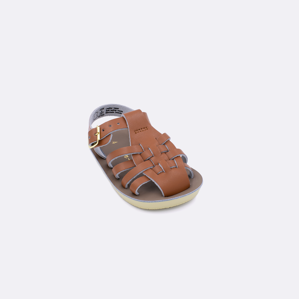 One baby sized 4200 Sailor style sandal with tan straps and a beige insole. Facing left to right diagonally.