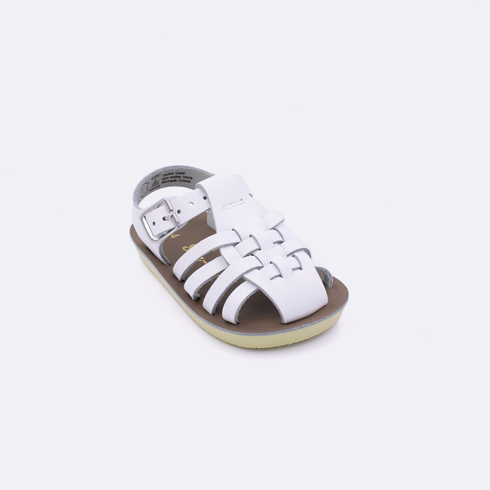 One baby sized 4200 Sailor style sandal with white straps and a beige insole. Facing left to right diagonally.