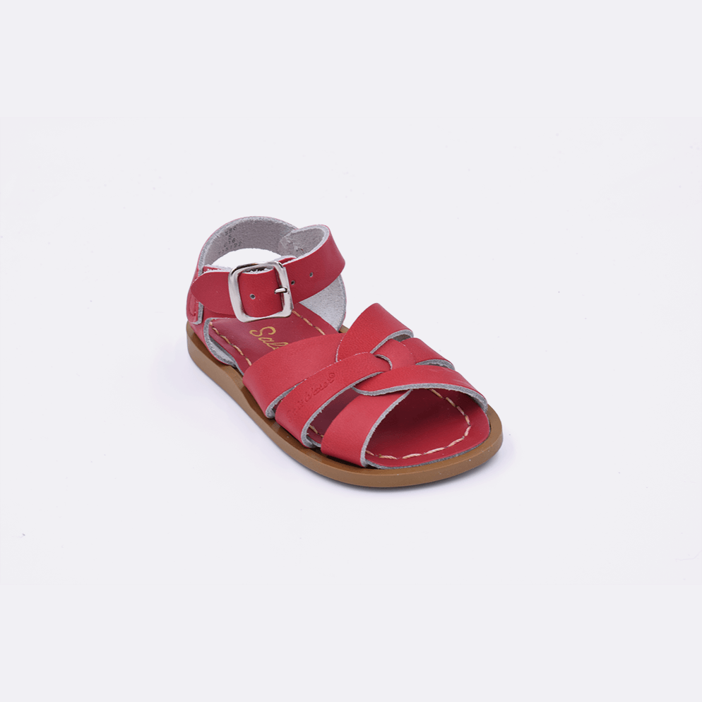 One baby size 800 Original style sandal color red. Facing left to right diagonally.