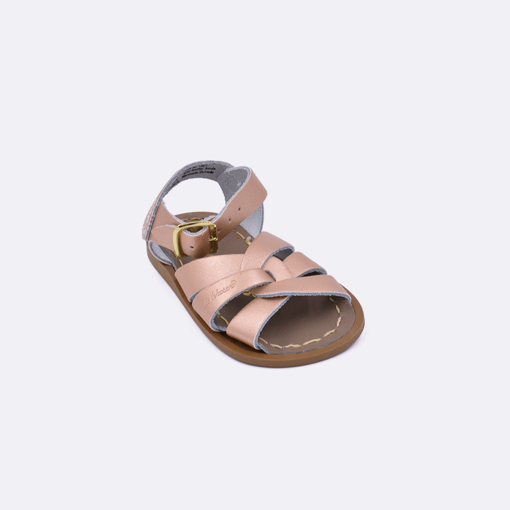 One baby size 800 Original style sandal color rose gold. Facing left to right diagonally.