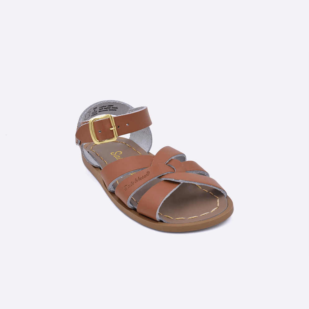 One toddler sized 800 Original style sandal with tan straps and a beige insole. Facing left to right diagonally.