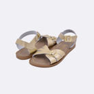 Two 900 Classic style sandal color gold. Both pushed together facing the camera diagonally.	Little Kid Size.