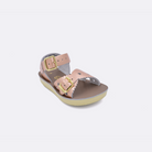 One toddler sized 1400 Sweetheart style sandal with rose gold straps and a beige insole. Facing left to right diagonally. 