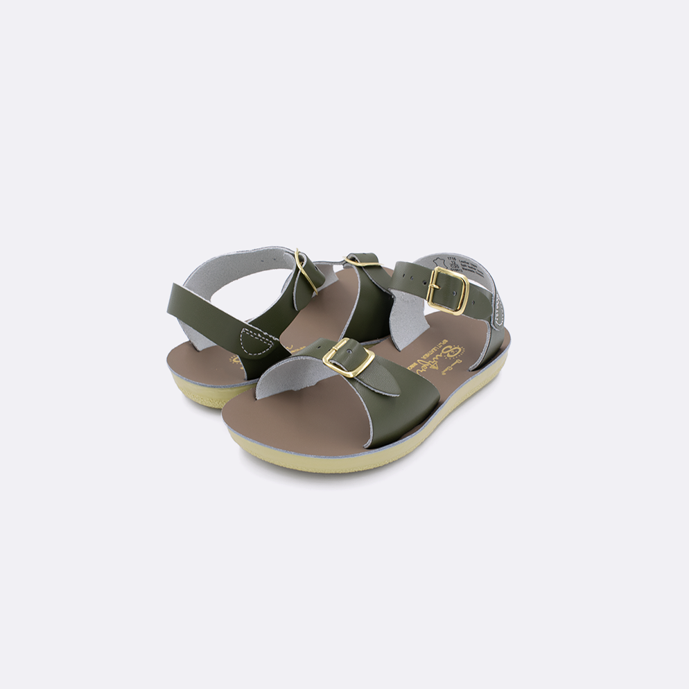 Two  toddler sized 1700 Surfer style sandals with olive straps and beige insoles. Both pushed together facing the camera diagonally.