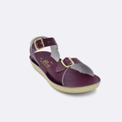 One little kid sized 1700 Surfer style sandal with claret straps and a claret insole. Facing left to right diagonally. 