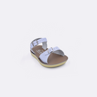 One toddler sized 1700 Surfer style sandal with light blue straps and a beige insole. Facing left to right diagonally. 