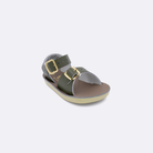 One baby sized 1700 Surfer style sandal with olive straps and a beige insole. Facing left to right diagonally. 