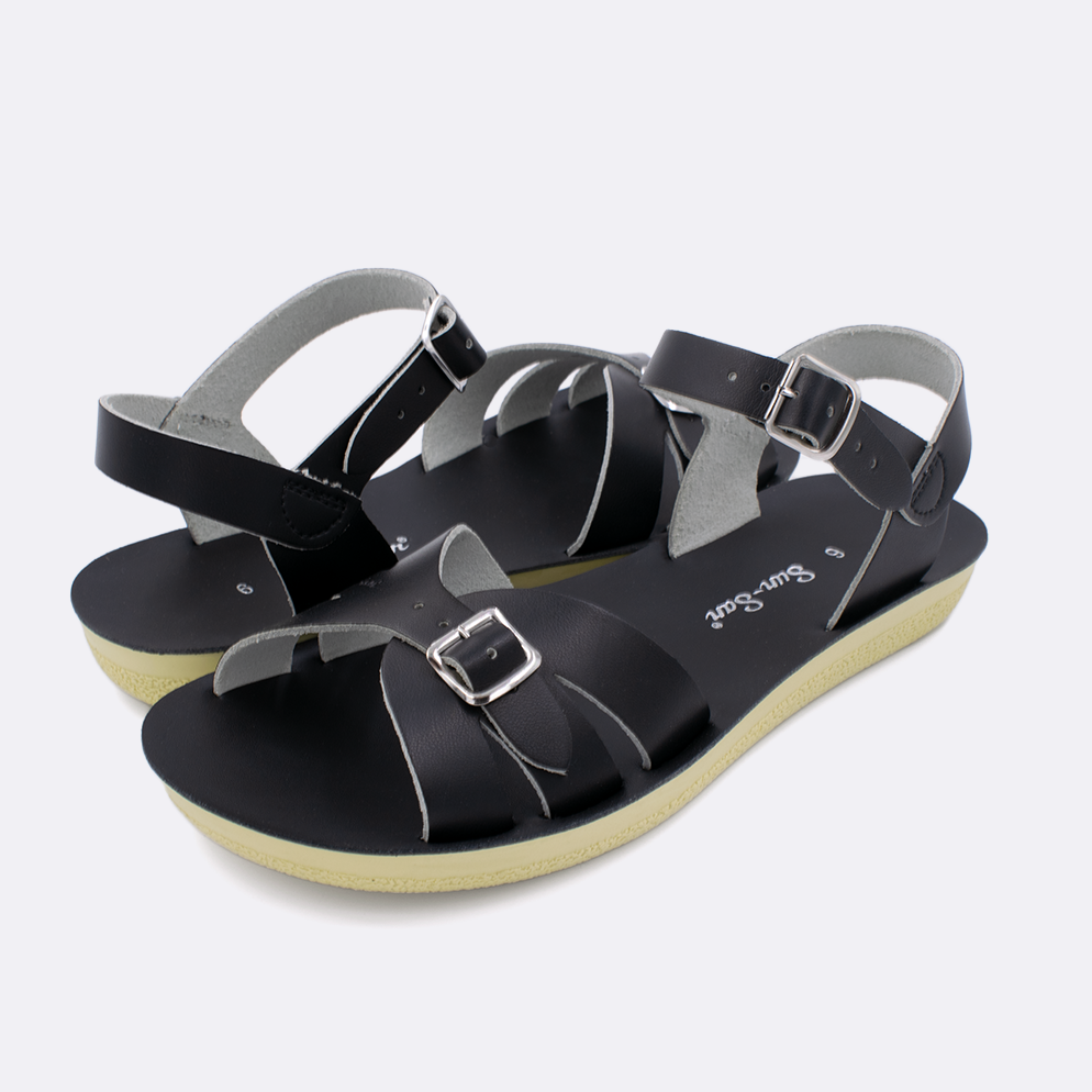 Two Women's sized 1900 Boardwalk style sandals with black straps and black insoles. Both pushed together facing the camera diagonally.