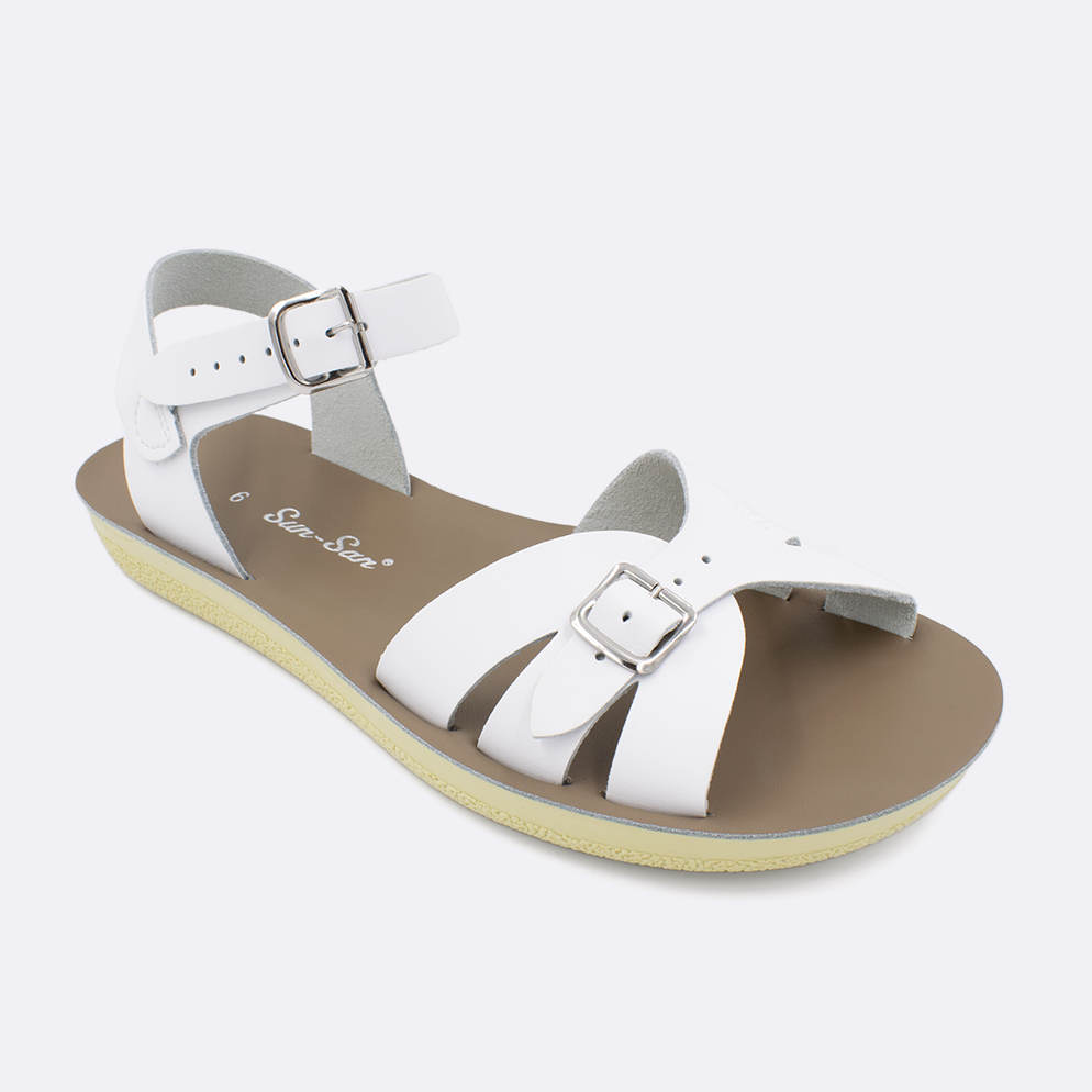 One Women's sized 1900 Boardwalk style sandal with white straps and a beige insole. Facing left to right diagonally. 