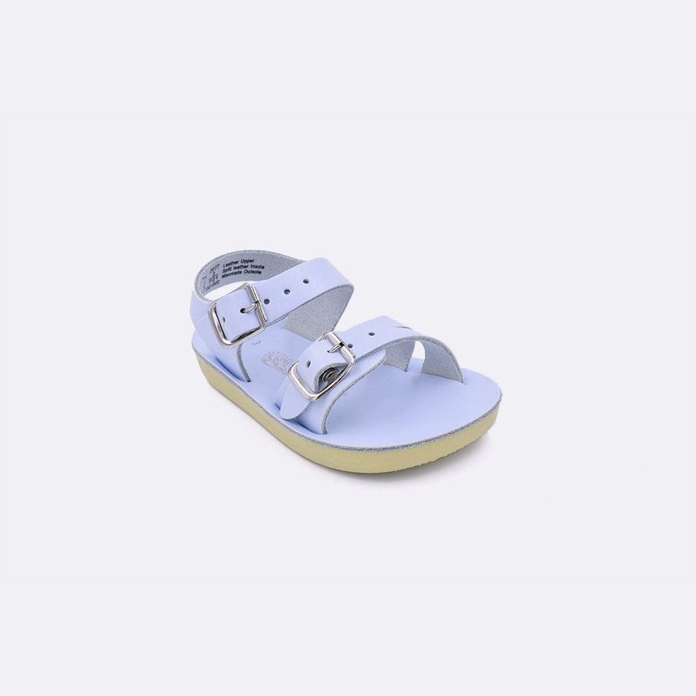 One baby sized 2000 Sea Wee style sandal with light blue straps and a beige insole. Facing left to right diagonally. 