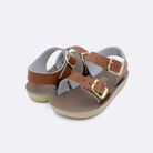 Two baby sized 2000 Sea Wee style sandals with tan straps and beige insoles. Both pushed together facing the camera diagonally.