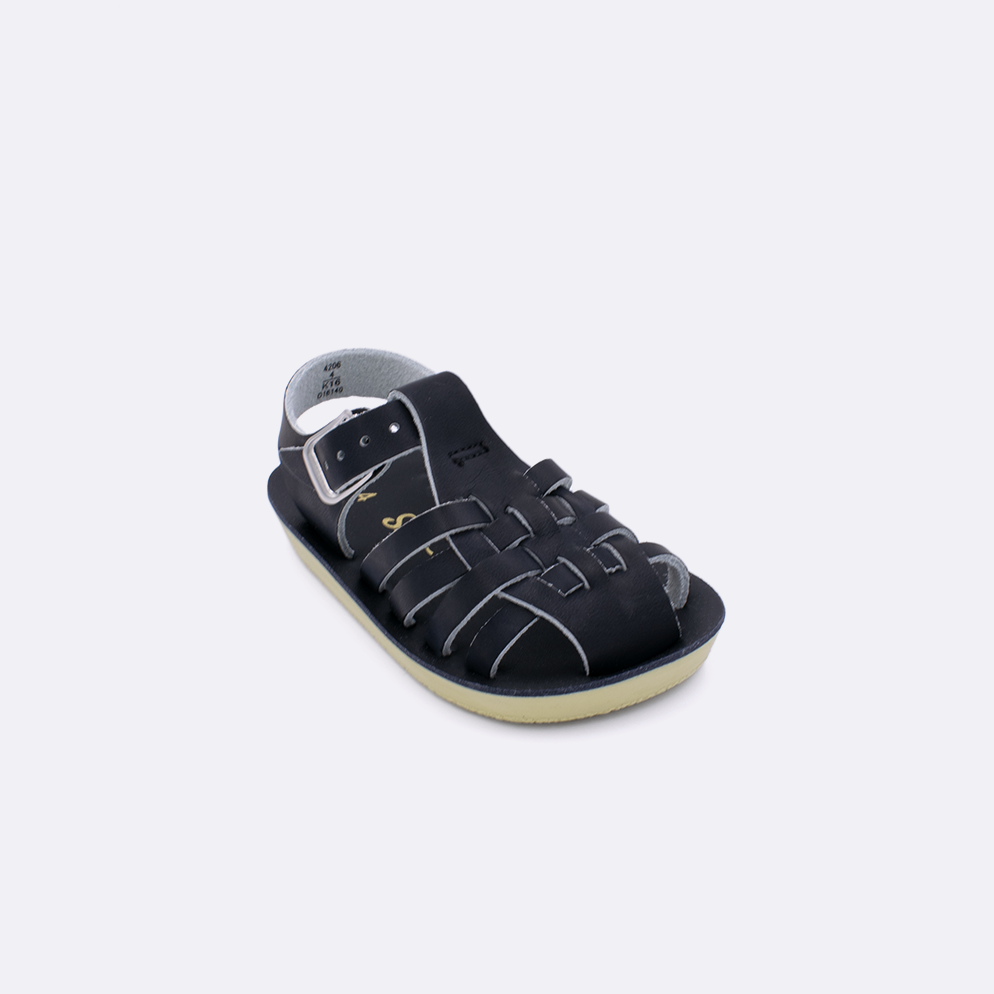One baby sized 4200 Sailor style sandal with black straps and a black insole. Facing left to right diagonally. 