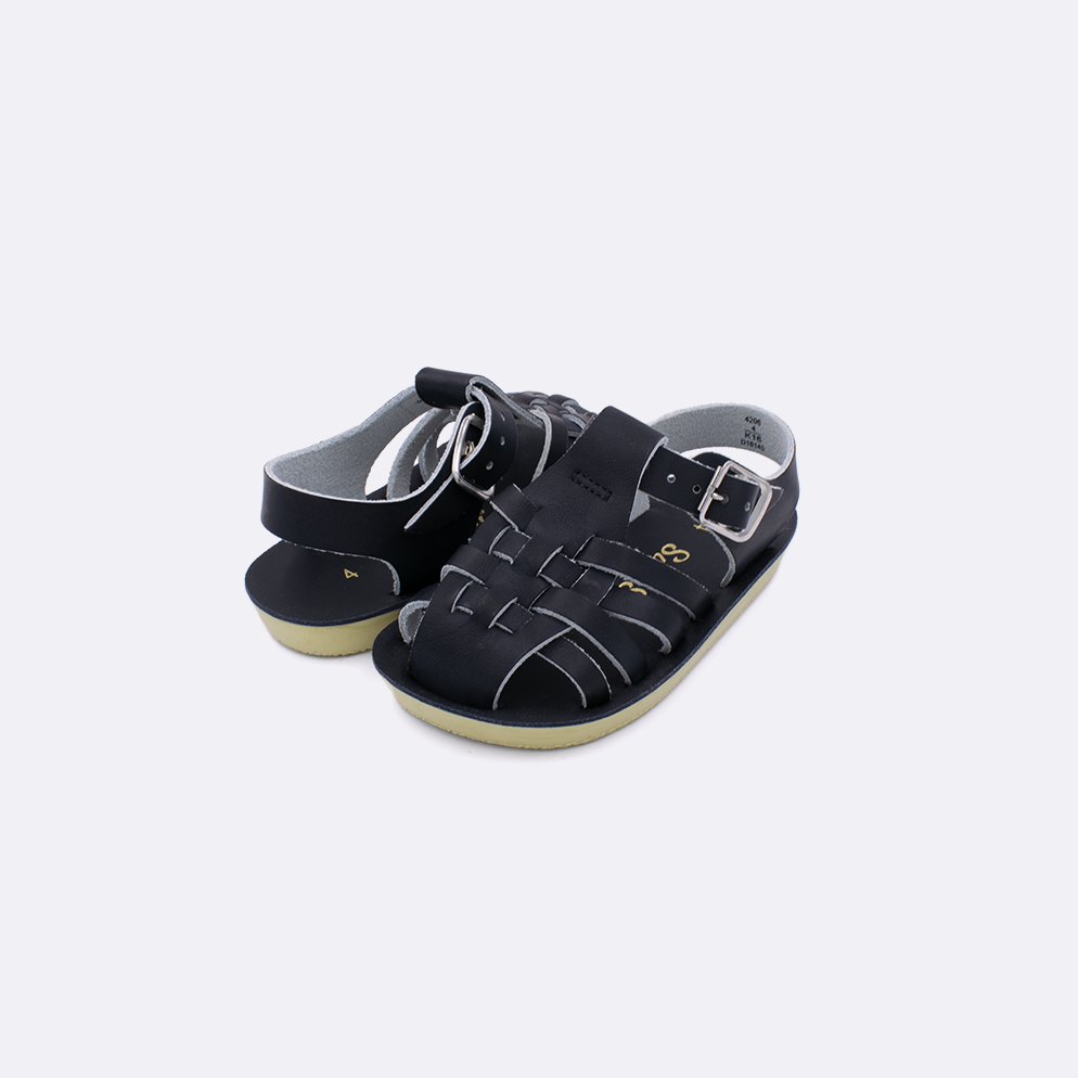 Two baby sized 4200 Sailor style sandals with black straps and black insoles. Both pushed together facing the camera diagonally.