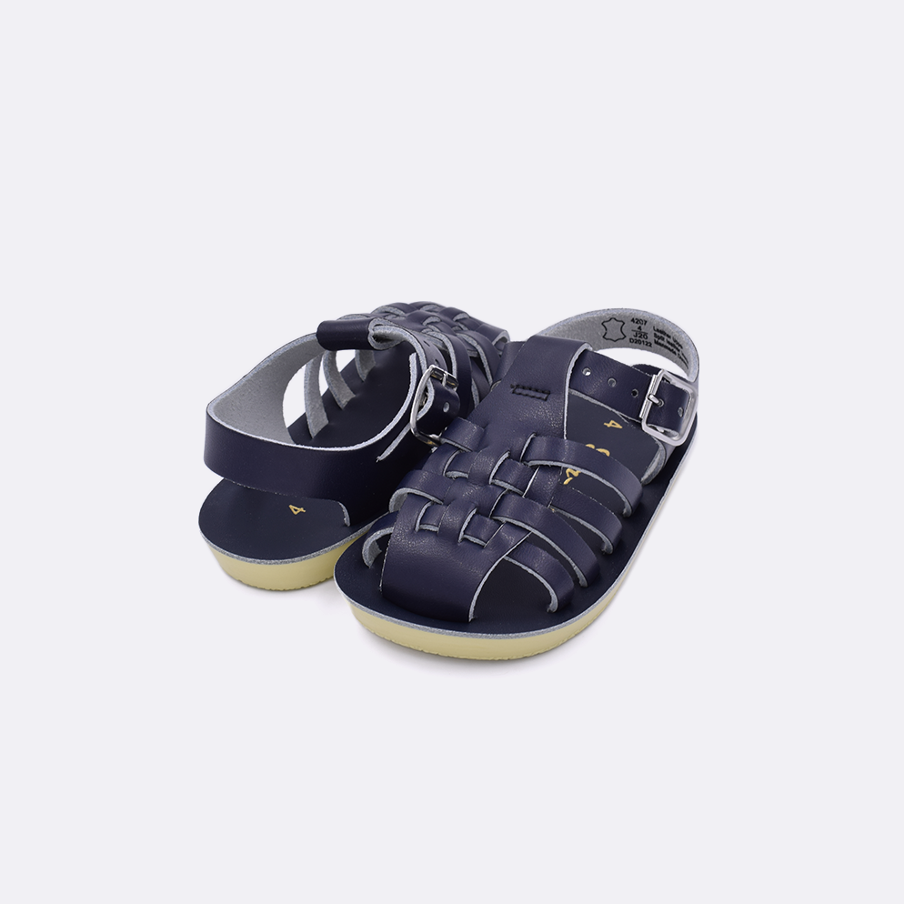 Two baby sized 4200 Sailor style sandals with navy straps and navy insoles. Both pushed together facing the camera diagonally.