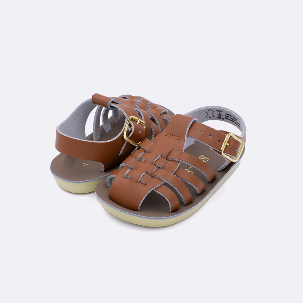 Two baby sized 4200 Sailor style sandals with tan straps and beige insoles. Both pushed together facing the camera diagonally.