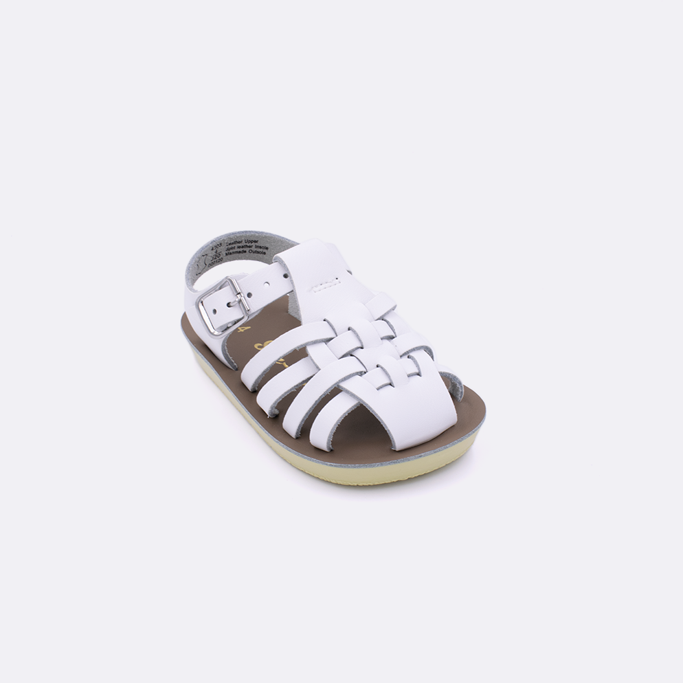 One baby sized 4200 Sailor style sandal with white straps and a beige insole. Facing left to right diagonally. 