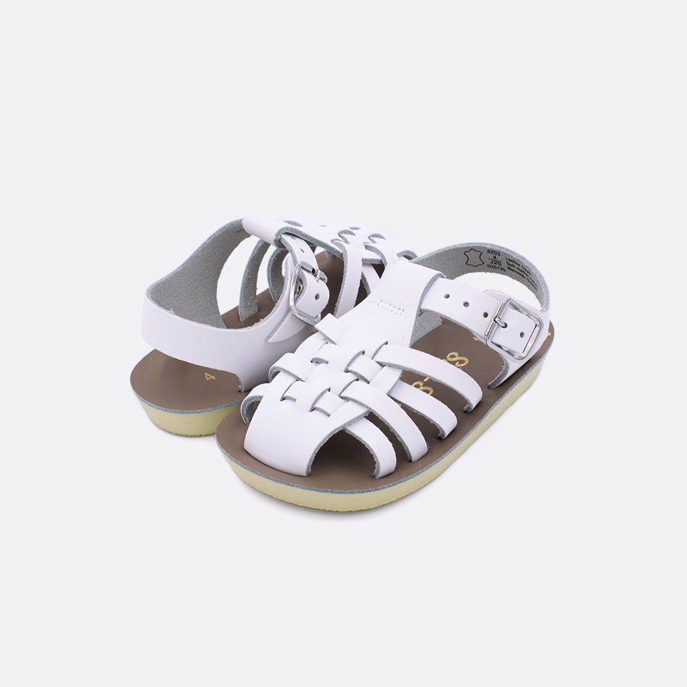 Two baby sized 4200 Sailor style sandals with white straps and beige insoles. Both pushed together facing the camera diagonally.