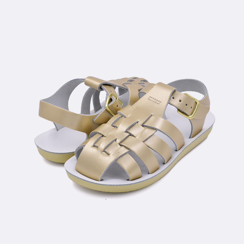 Two little kid sized 4200 Sailor style sandals with gold straps and white insoles. Both pushed together facing the camera diagonally.