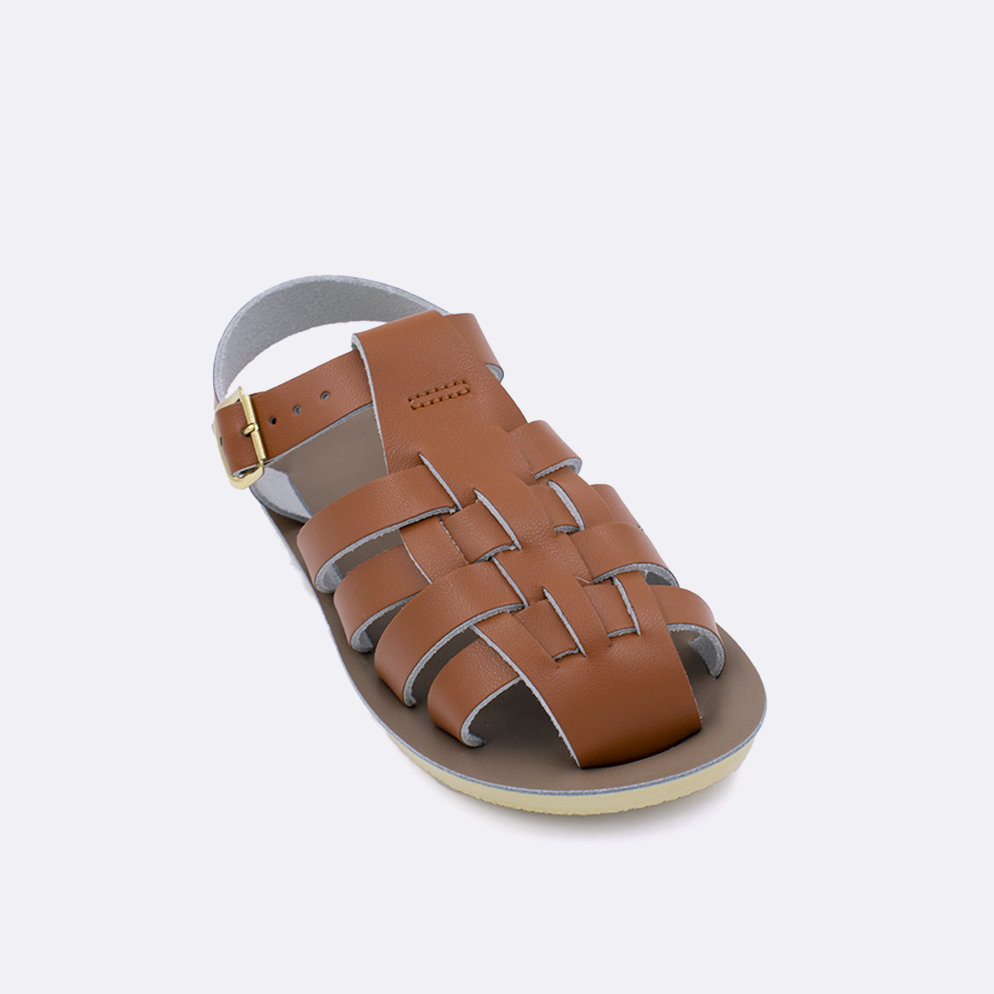One little kid sized 4200 Sailor style sandal with tan straps and a beige insole. Facing left to right diagonally. 
