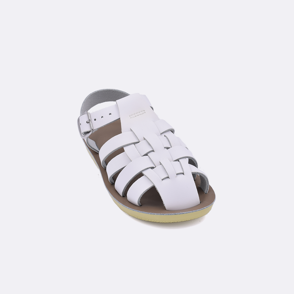 One little kid sized 4200 Sailor style sandal with white straps and a beige insole. Facing left to right diagonally. 