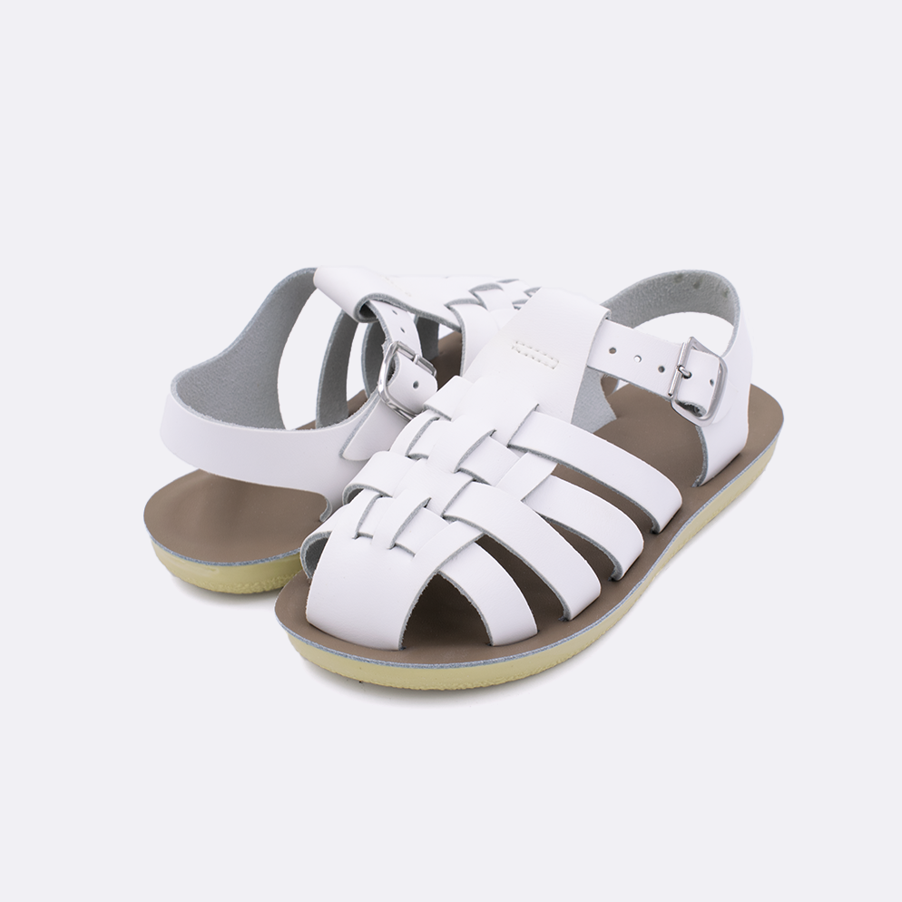 Two little kid sized 4200 Sailor style sandals with white straps and beige insoles. Both pushed together facing the camera diagonally.