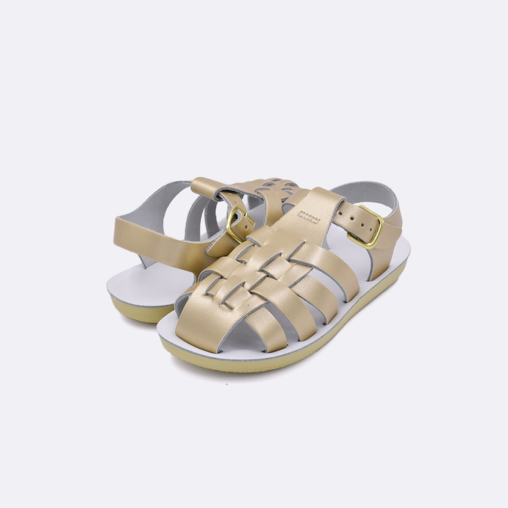 Two toddler sized 4200 Sailor style sandals with gold straps and white insoles. Both pushed together facing the camera diagonally.