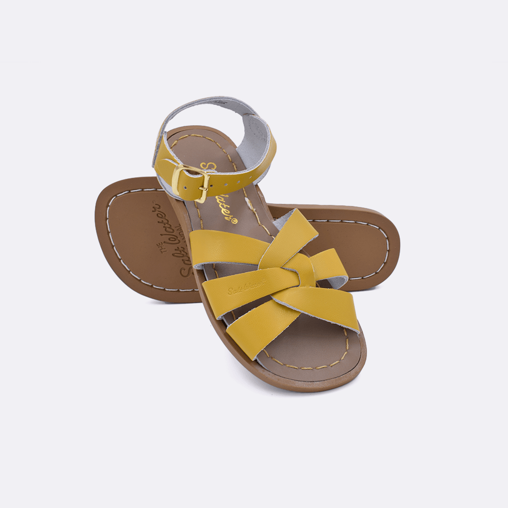 Two mustard little kid sized 800 Original style sandal. Both pushed together facing the camera diagonally.