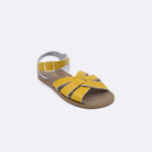 One mustard little kid sized 800 Original style sandal. Facing left to right diagonally. 