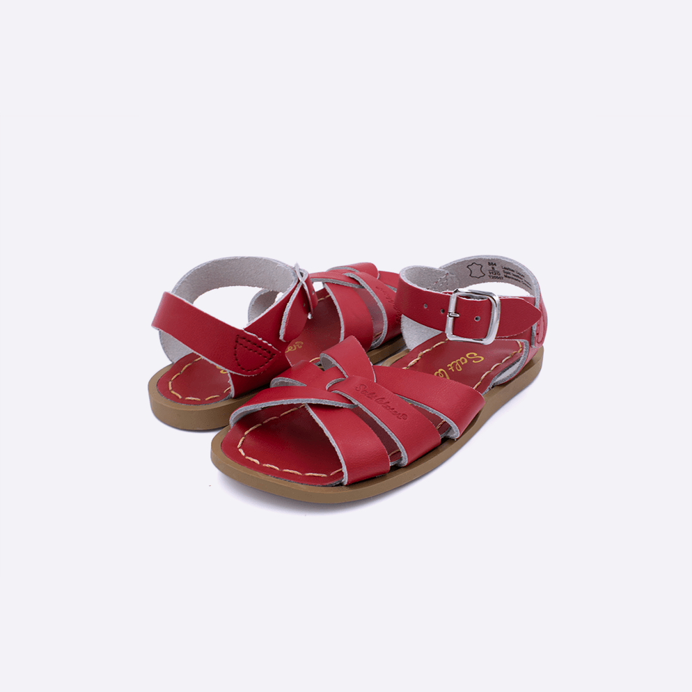 Two toddler sized 800 Original style sandals with red straps and red insoles. Both pushed together facing the camera diagonally.
