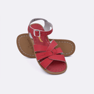 Two red little kid sized 800 Original style sandals.  One standing with the sole facing the camera. The second is laying diagonally over the top left edge of the sole.