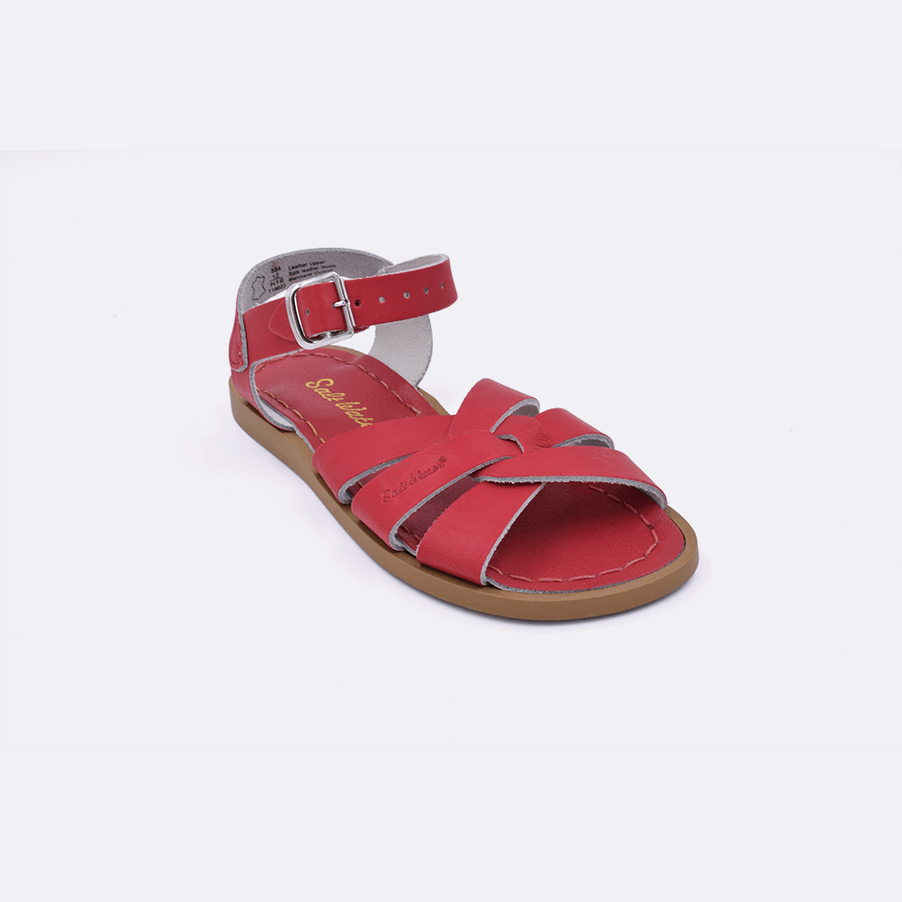One red little kid sized 800 Original style sandal. Facing left to right diagonally. 