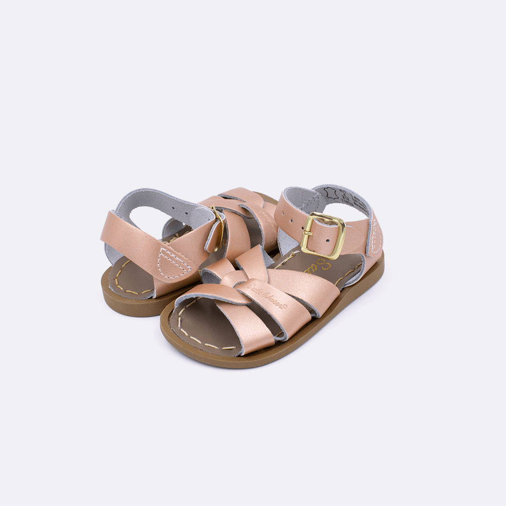 Two baby size 800 Original style sandal color rose gold. Both pushed together facing the camera diagonally.