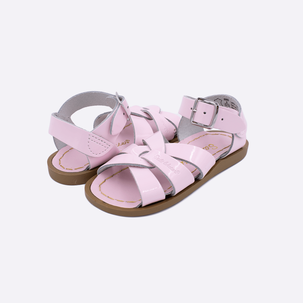 Two toddler sized 800 Original style sandals with shiny pink straps and shiny pink insoles. Both pushed together facing the camera diagonally.