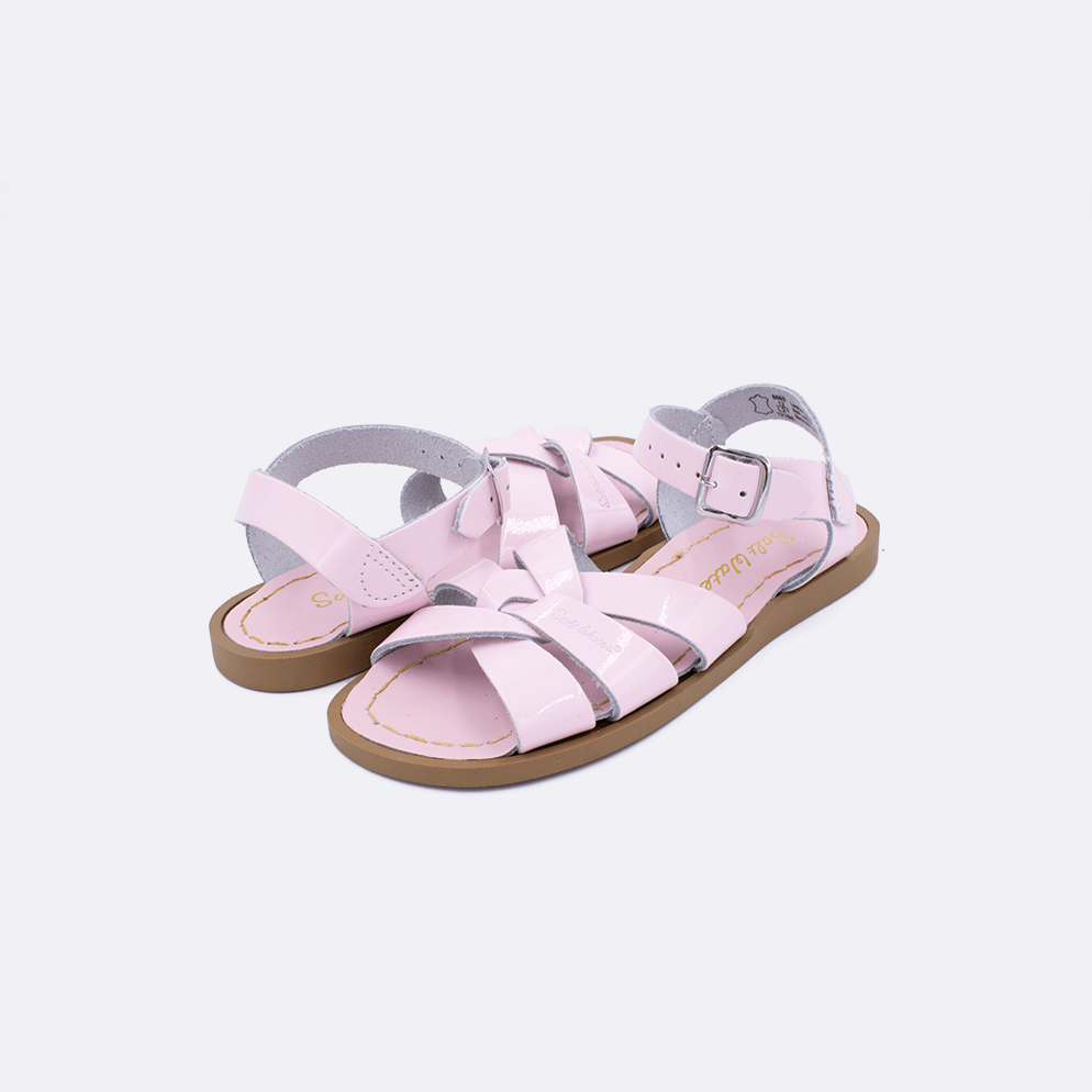 Two shiny pink little kid sized 800 Original style sandal. Both pushed together facing the camera diagonally.