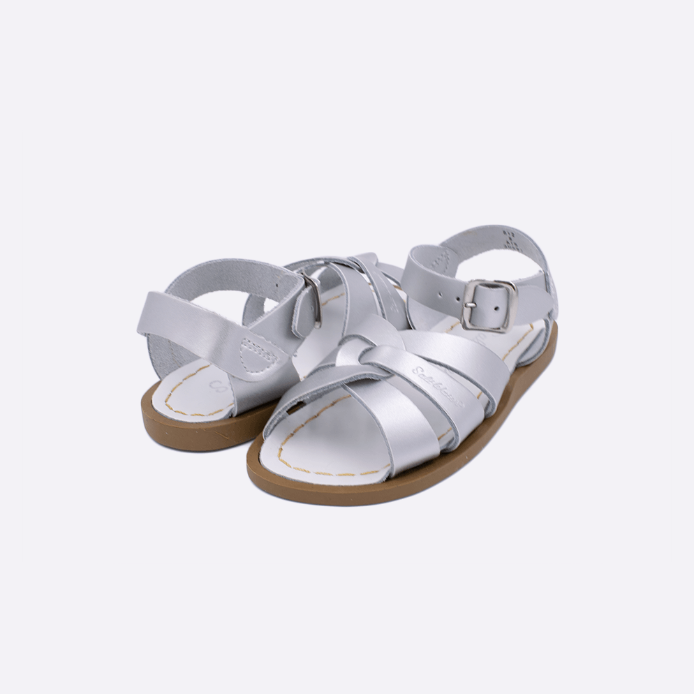 Two toddler sized 800 Original style sandals with silver straps and white insoles. Both pushed together facing the camera diagonally.
