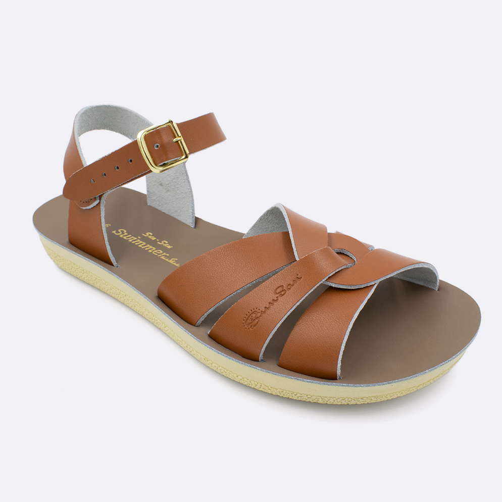 One women's sized 8000 Swimmer style sandal with tan straps and a beige insole. Facing left to right diagonally. 
