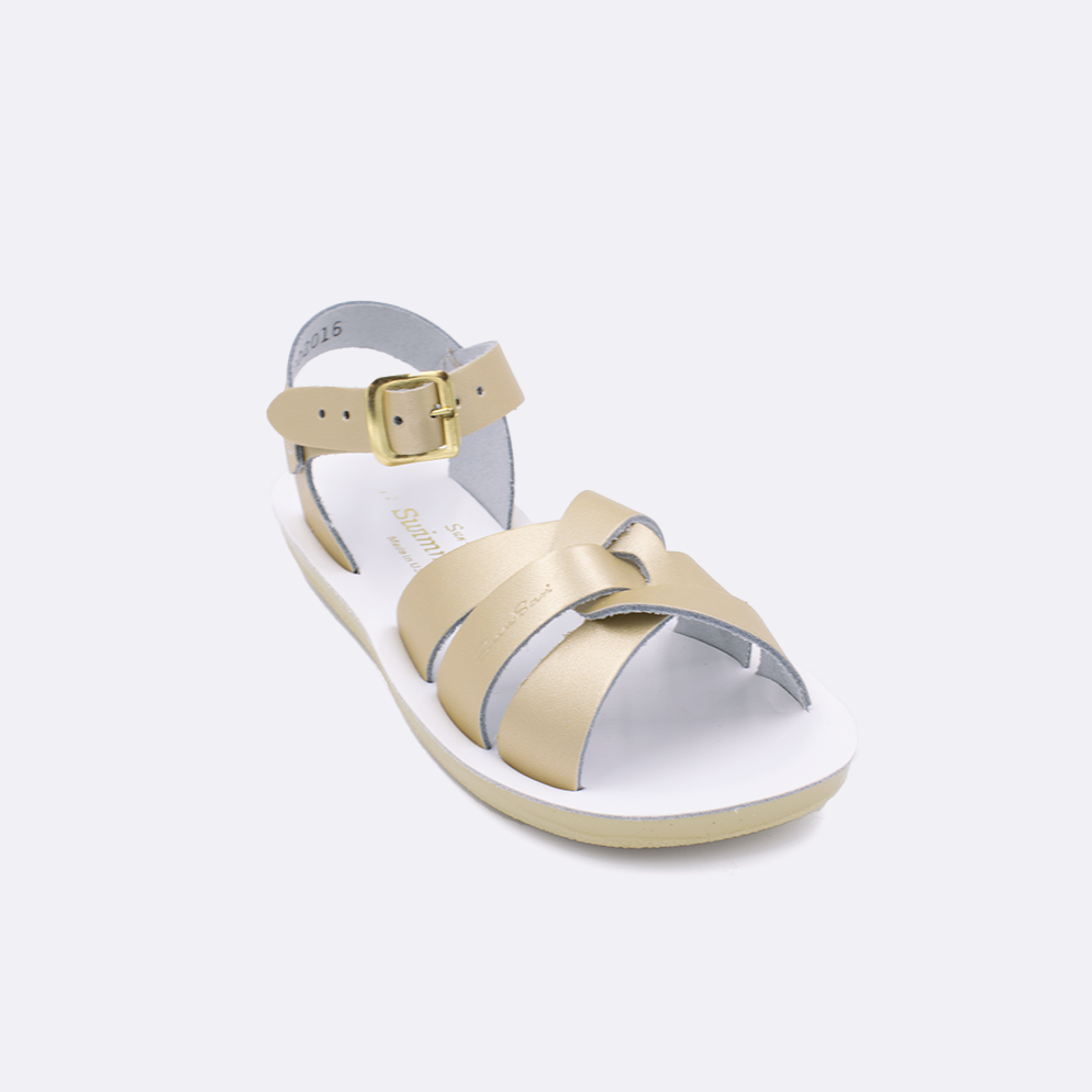 One little kid sized 8000 Swimmer style sandal with gold straps and a white insole. Facing left to right diagonally. 