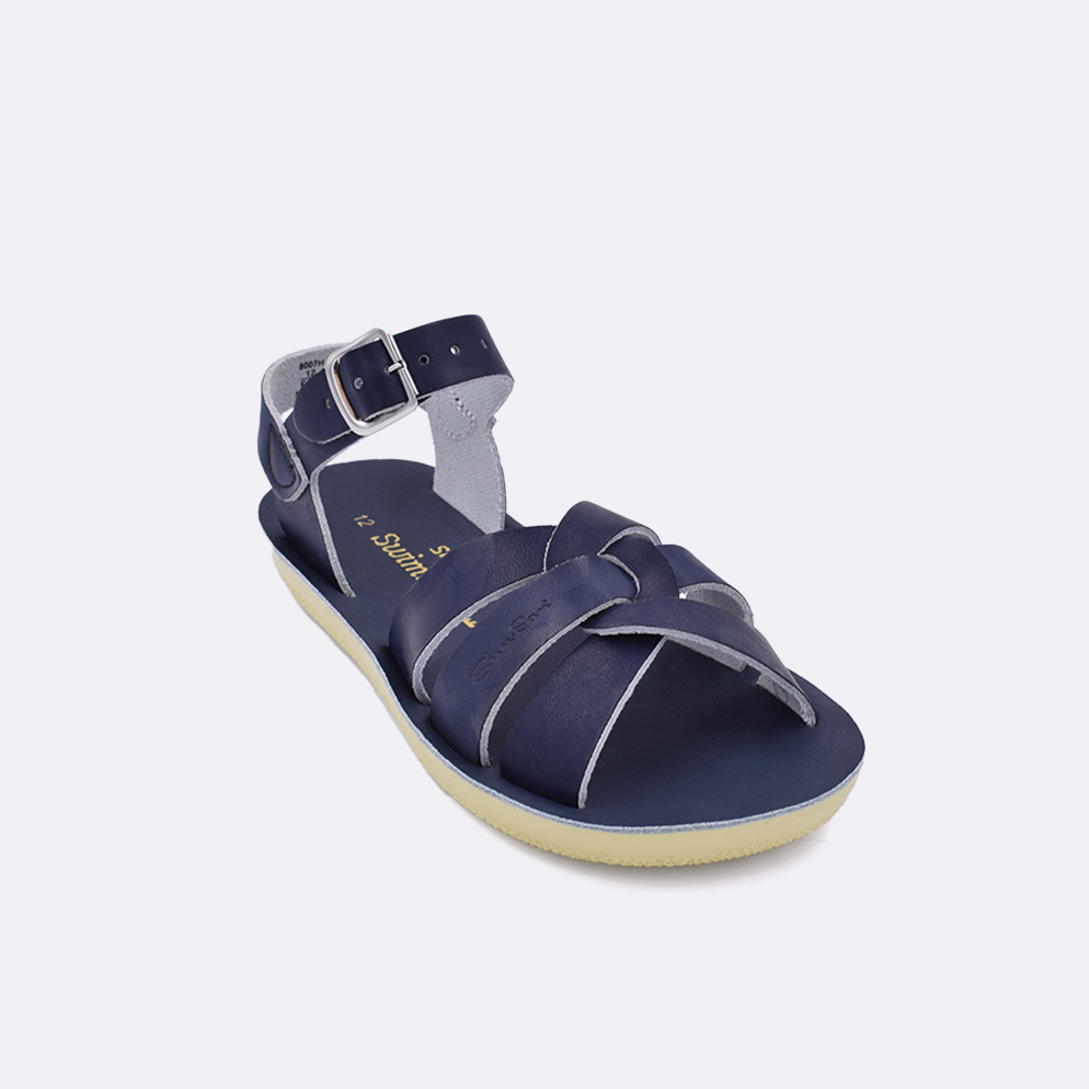 One little kid sized 8000 Swimmer style sandal with navy straps and a navy insole. Facing left to right diagonally. 