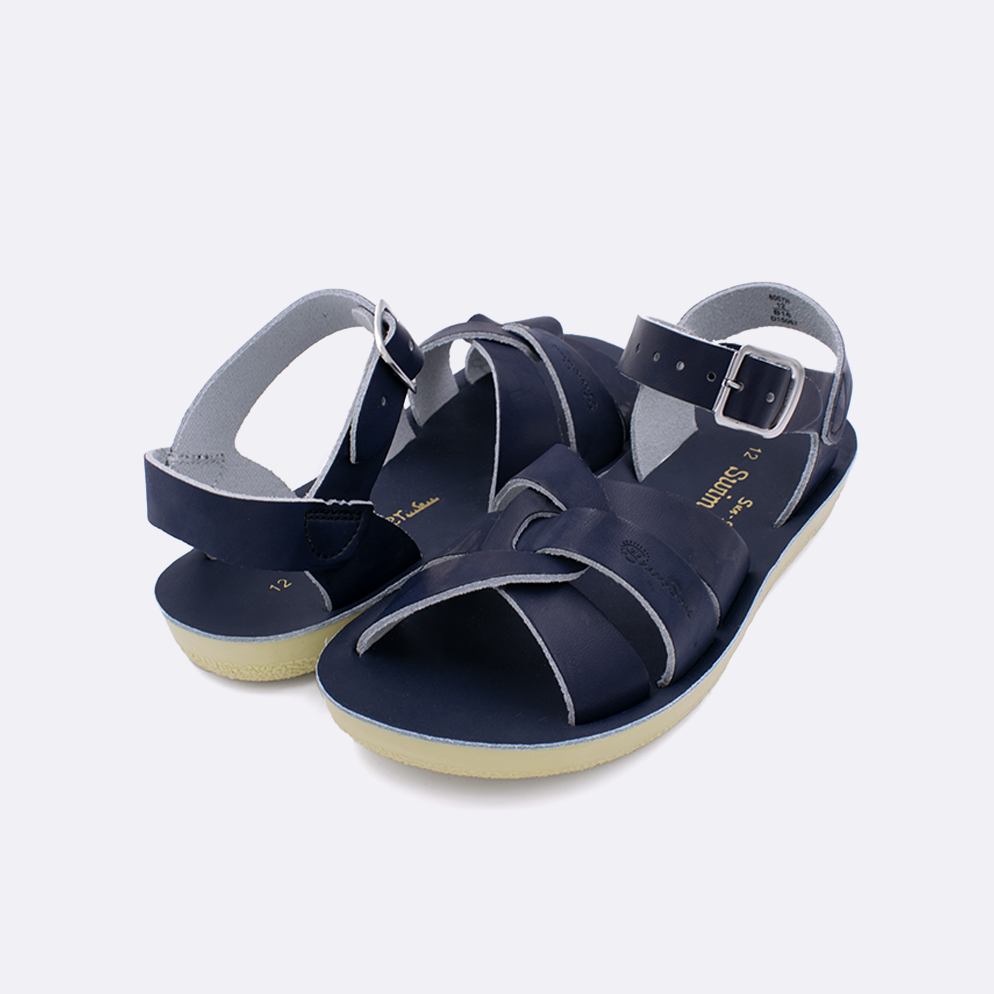 Two little kid sized 8000 Swimmer style sandals with navy straps and navy insoles. Both pushed together facing the camera diagonally.