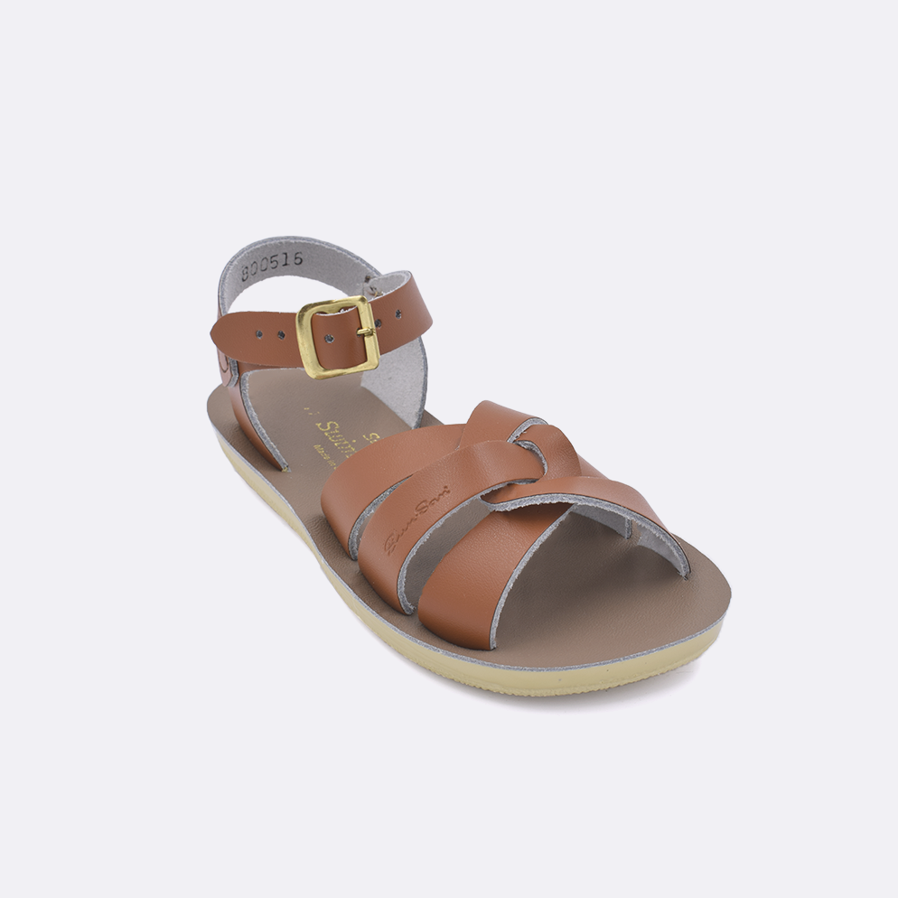 One little kid sized 8000 Swimmer style sandal with tan straps and a beige insole. Facing left to right diagonally. 