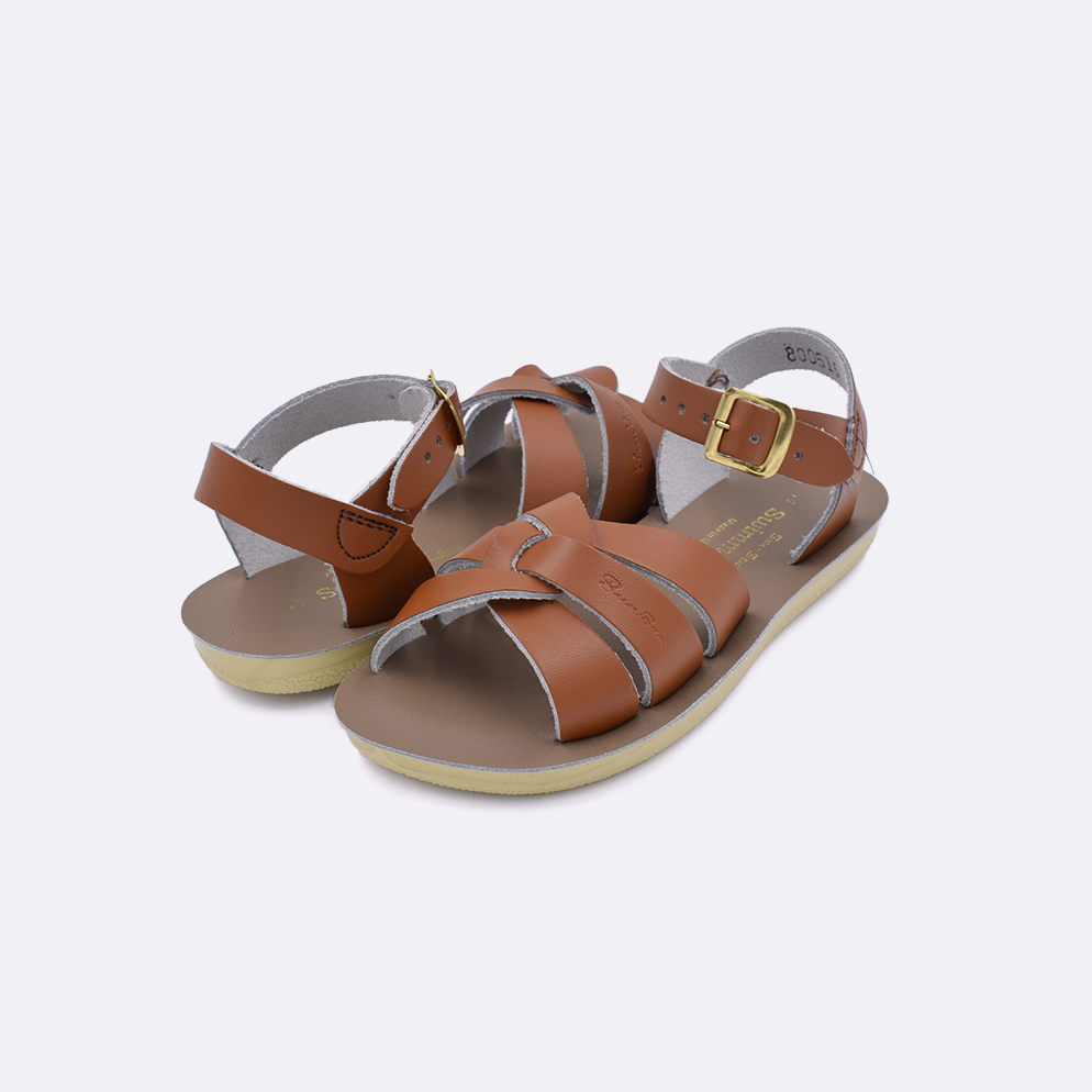 Two little kid sized 8000 Swimmer style sandals with tan straps and beige insoles. Both pushed together facing the camera diagonally.