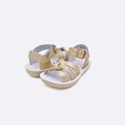 Two toddler sized 8000 Swimmer style sandals with gold straps and white insoles. Both pushed together facing the camera diagonally.