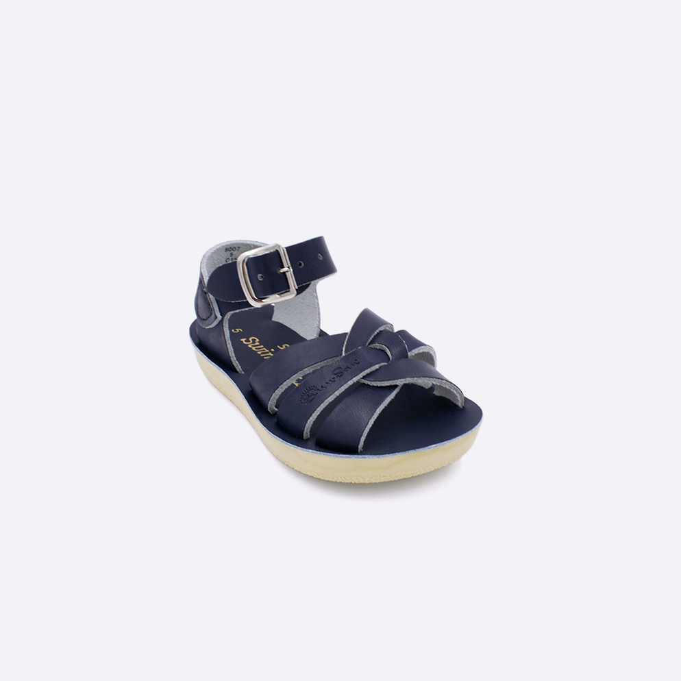 One toddler sized 8000 Swimmer style sandal with navy straps and a navy insole. Facing left to right diagonally. 