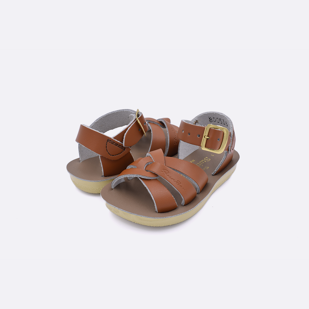 Two toddler sized 8000 Swimmer style sandals with tan straps and beige insoles. Both pushed together facing the camera diagonally.