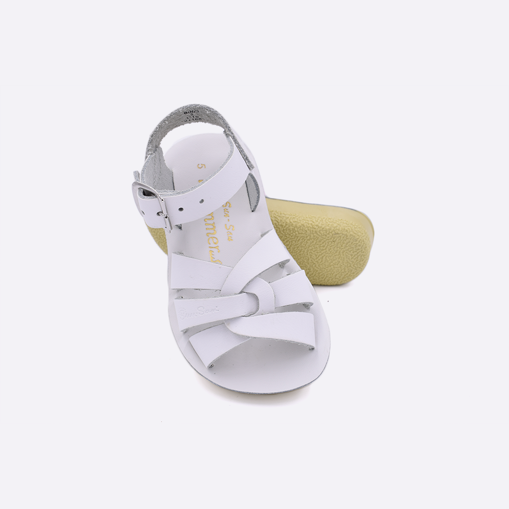 Two toddler sized 8000 Swimmer style sandals with white straps and white insoles.  One standing with the sole facing the camera. The second is laying diagonally over the top left edge of the sole.