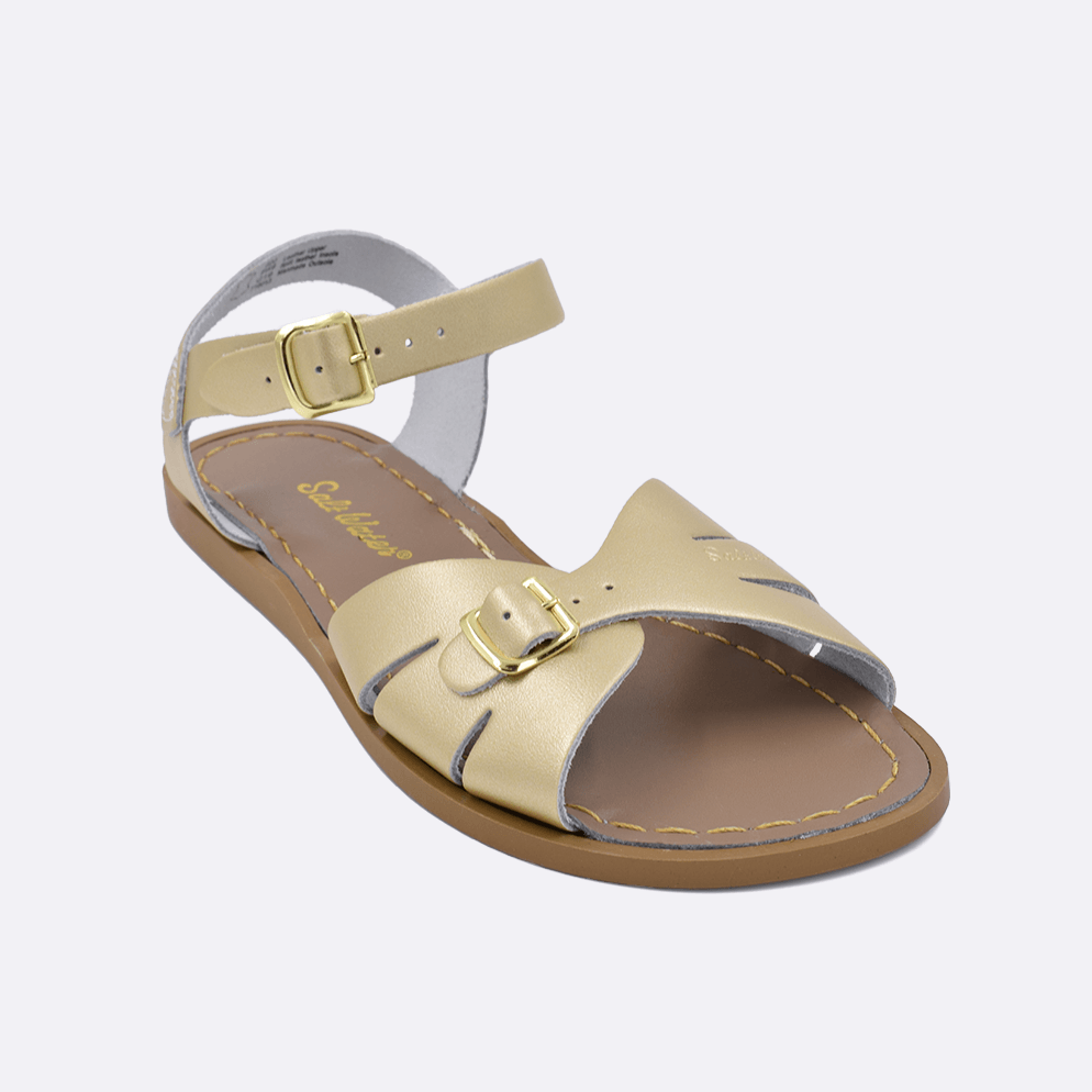 One 900 Classic style sandal color gold. Facing left to right diagonally. 	Adult Size.	